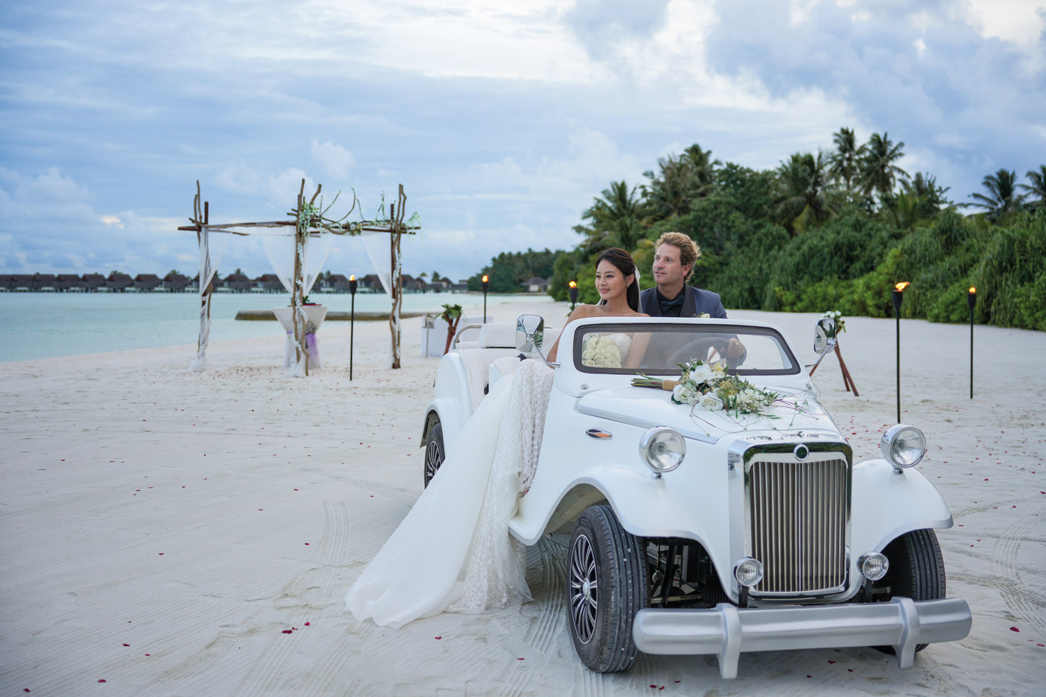 Niyama_Private_Islands_Maldives_Beach_Wedding_Groom_And_Bride_On_A_Wedding_Car-©-Niyama-P-rivate-Islands